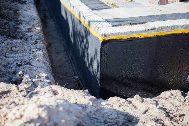 Professional Waterproofing technician working in Toms River, NJ